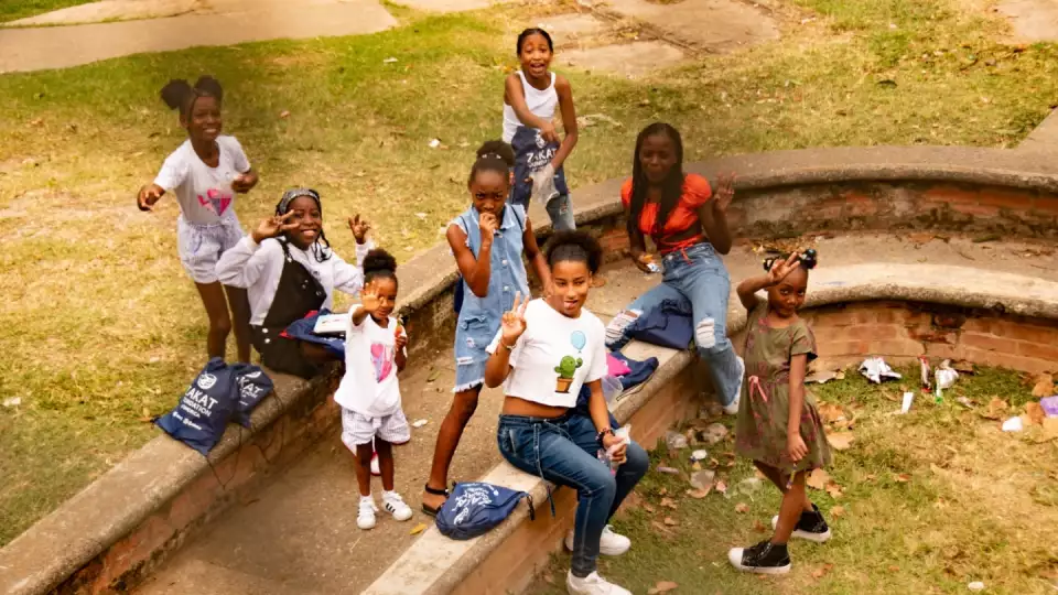 Colombia girls excitedly receive school supplies