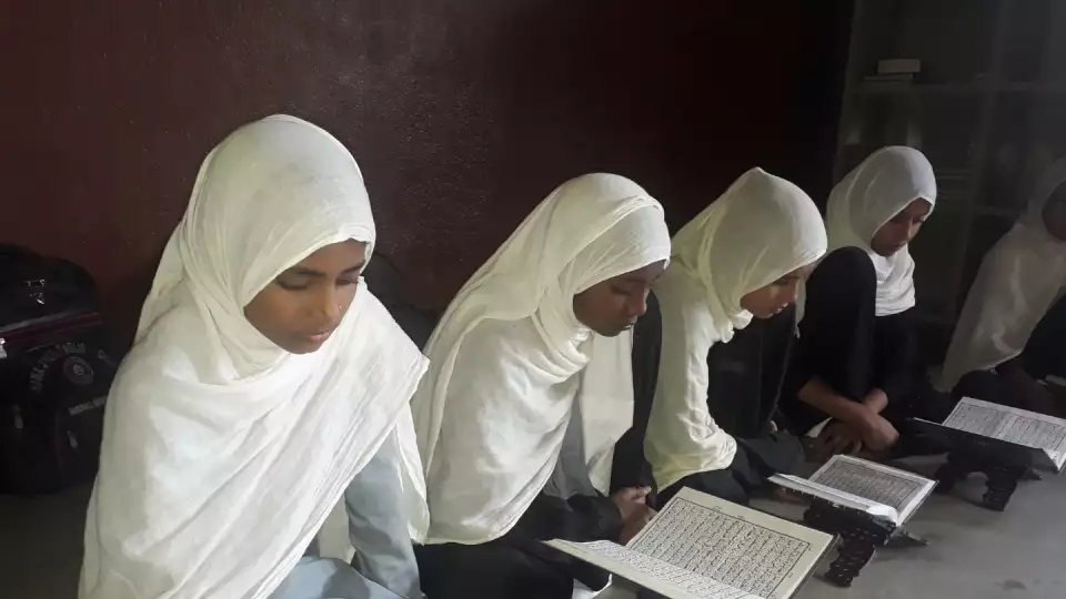 A group of girls in Nepal diligently study