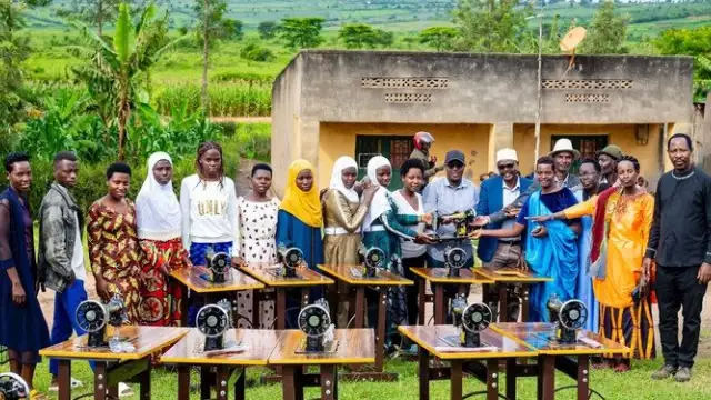 Empowering Youth Through Skills Beneficiaries from Gatsibo District pose for a group photo after receiving sewing machines, donated by Professor Katherine of Wharton University.