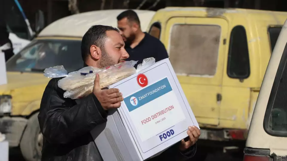 Food boxes with essentials are taken by displaced, needy and returning Syrian families.