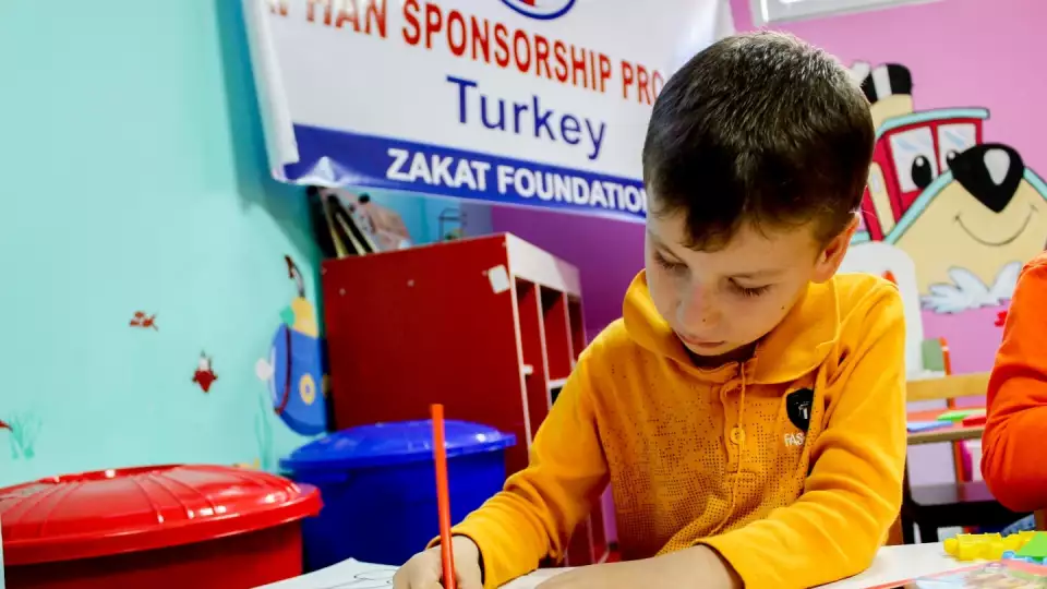 A student at an orphan sponsored school / طفل يتيم في مدرسة الأيتام
