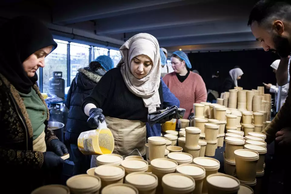 People prepare food for Iftar, the fast-breaking meal eaten by Muslims at sundown during the holy month of Ramadan, at a parking lot in Osdorp neighbourhood, on April 14, 2023. RAMON VAN FLYMEN, ANP/AFP Via Getty Images