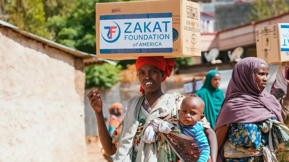 A young Ethiopian mother can feed her child a Ramadan meal