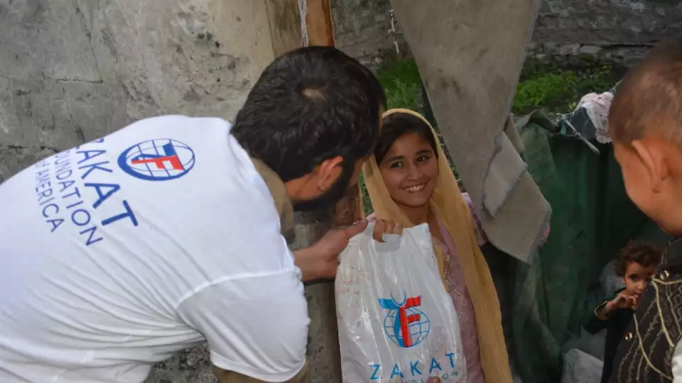 A little girl in Pakistan receives fresh Udhiyah meat
