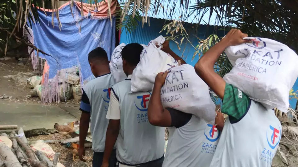 Bangladesh flood relief efforts reach vulnerable families with essentials.