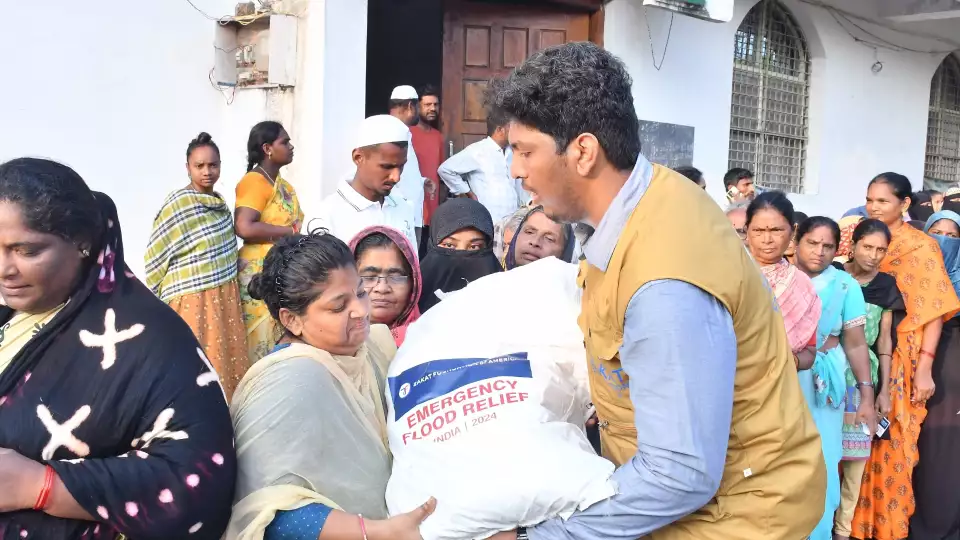 Flood emergency relief distributions in India help families displaced by rising waters.