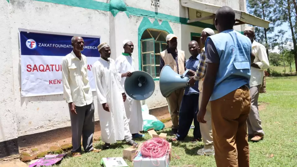 Our team reps work with local Kenya congregants to help install a speaker system for the call to prayer at a Zakat Foundation of America sponsored mosque.