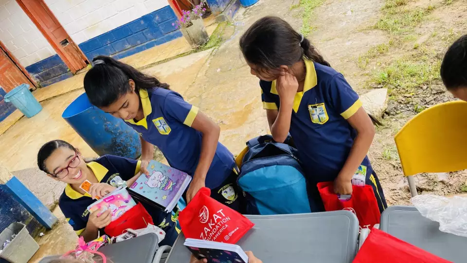 Students in Colombia prepare for class with our school supplies for ease in learning.
