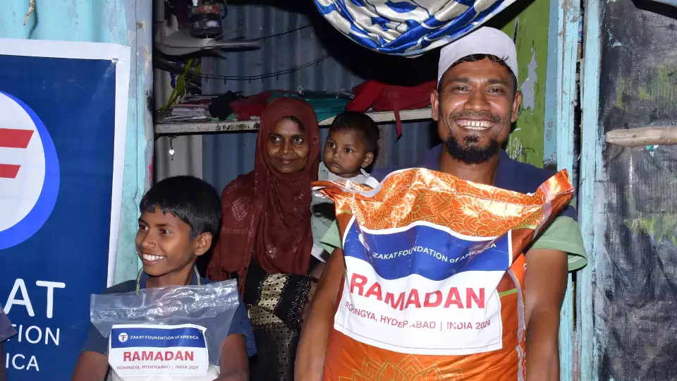 Rohingya refugees in India rejoice on receiving Ramadan food packages for their iftar meals.